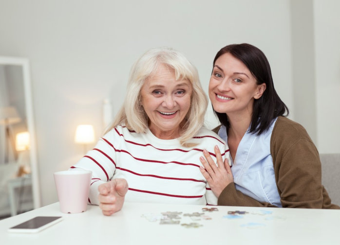 adult and senior woman smiling
